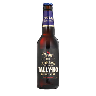 A bottle of Adnams Tally-Ho Barley Wine with a dark label and a blue cap.