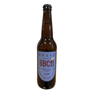 Brown beer bottle with a purple label on a white background
