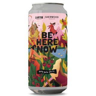 Beer can with colorful design and 'Be Here Now' text on a white background