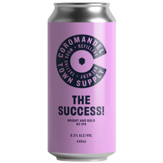 Purple beer can with 'Coromandel Town Supply' branding on a white background